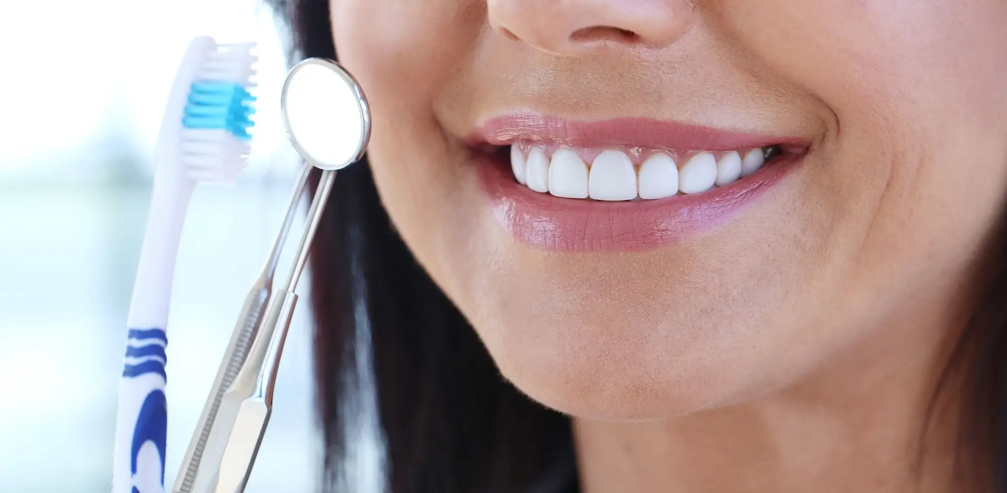 A smiling patient after receiving preventive and hygiene care in NYC