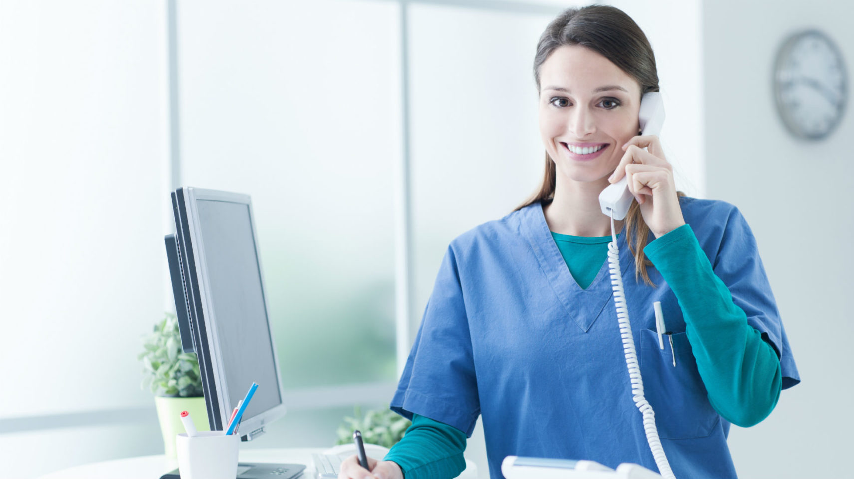 receptionist booking dental appointment