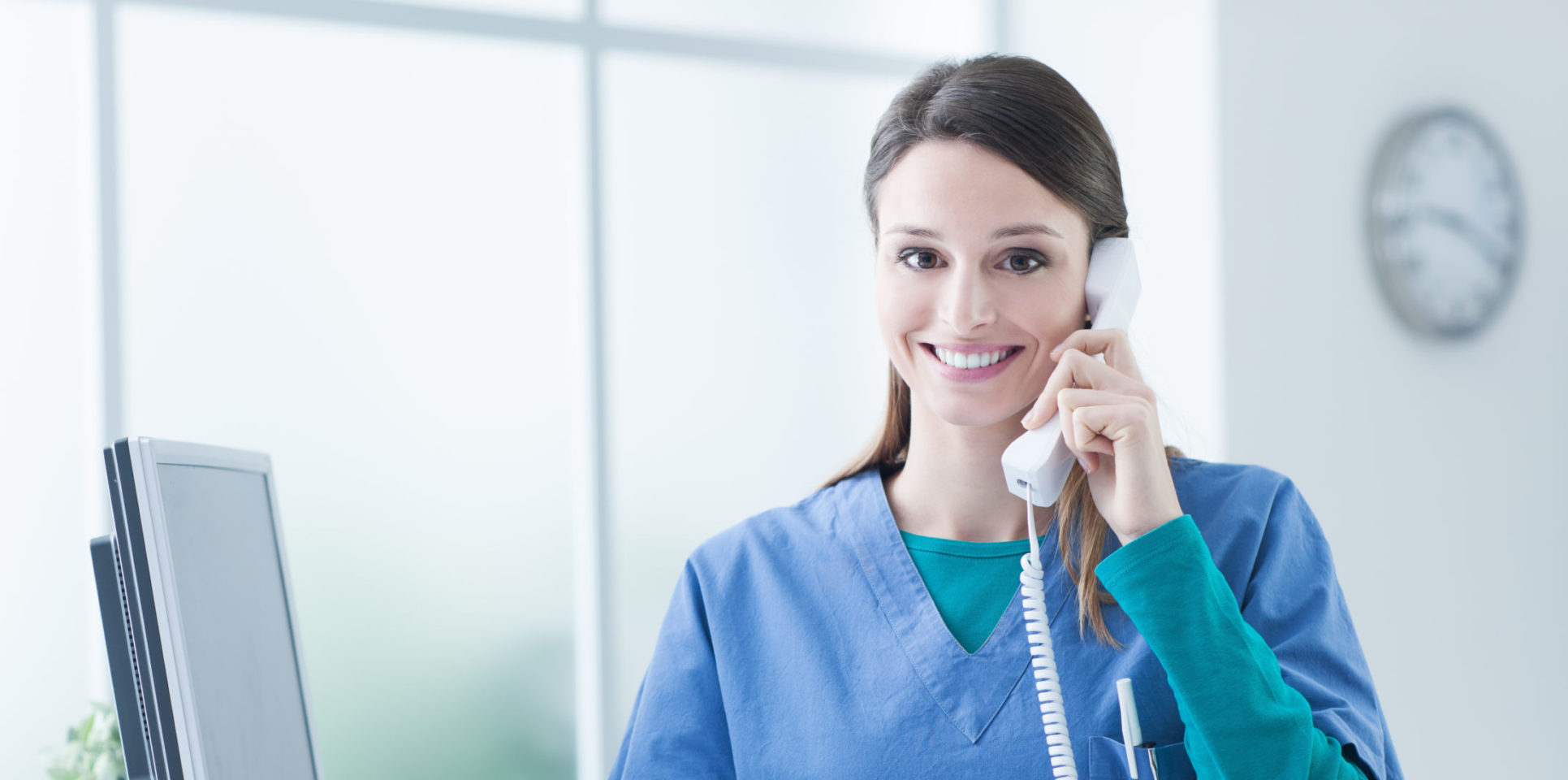 Dental receptionist smiling