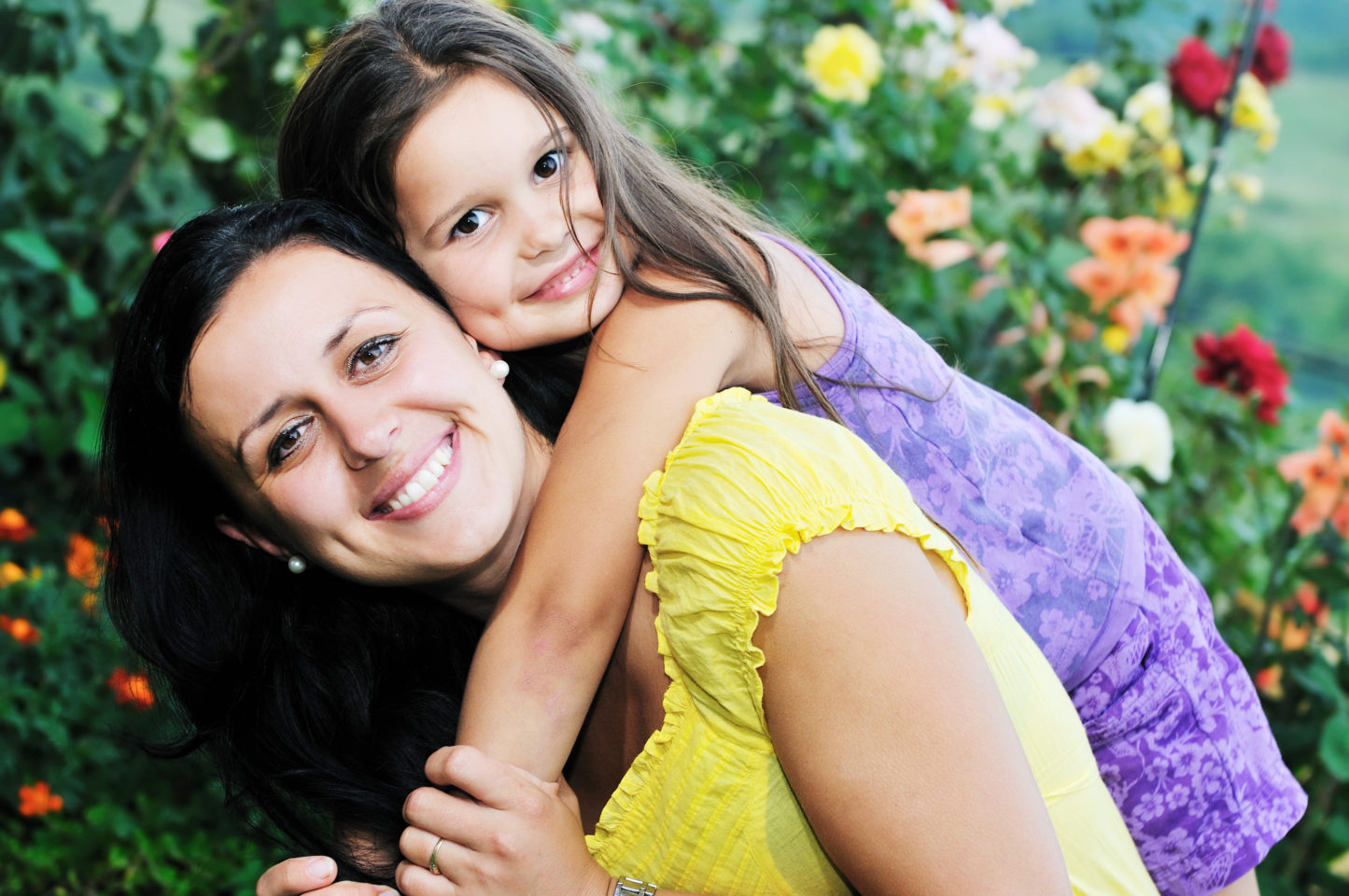 happy mom and daughter outdoor