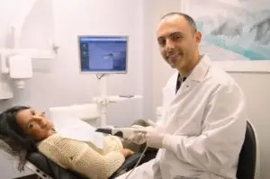 A New York cosmetic dentist speaking with a patient