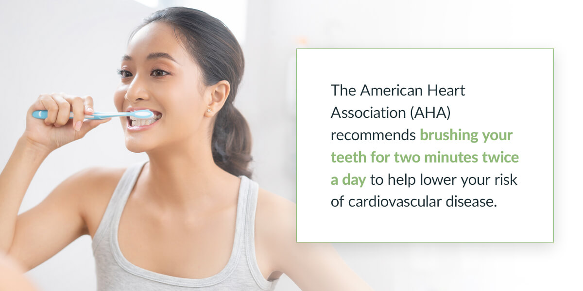 A person brushing her teeth to avoid gum disease signs and symptoms