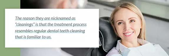 A dentist explaining a professional teeth cleaning