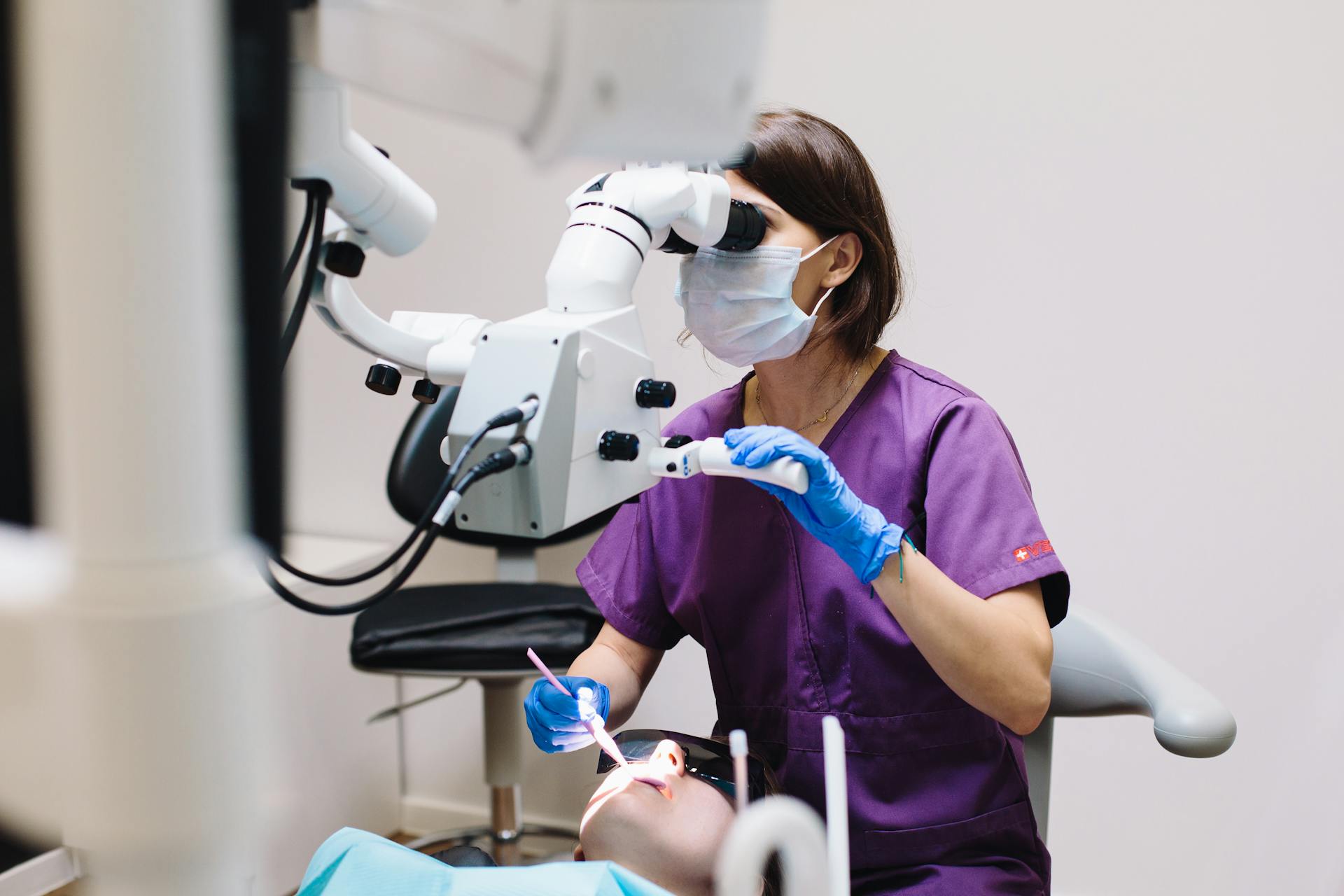A tooth decay dentist near me examining a patient