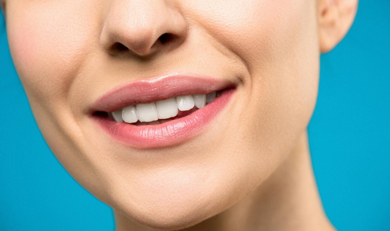 A smiling person who received tooth decay treatment