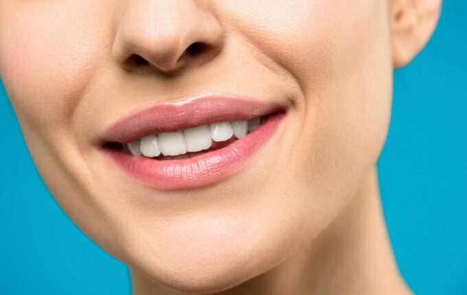 A smiling person who received tooth decay treatment