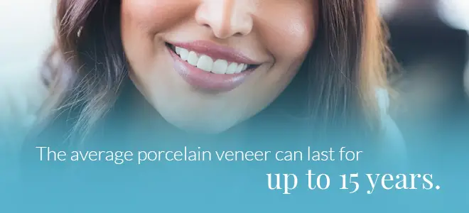 A person with long hair smiling, that’s above information about how long veneers last, which is helpful for someone comparing veneers vs. braces.