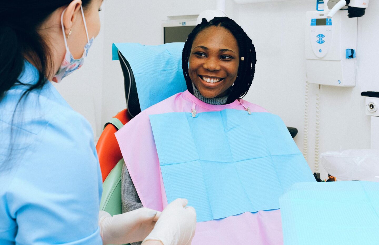 A dentist speaking to a patient about when it’s too late for bone and gum grafting